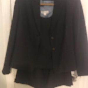 A three piece suit in the color charcoal grey